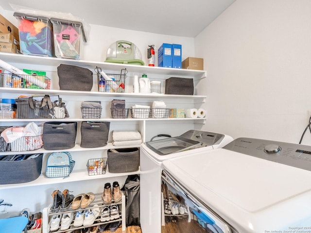 laundry area with laundry area and washer and clothes dryer