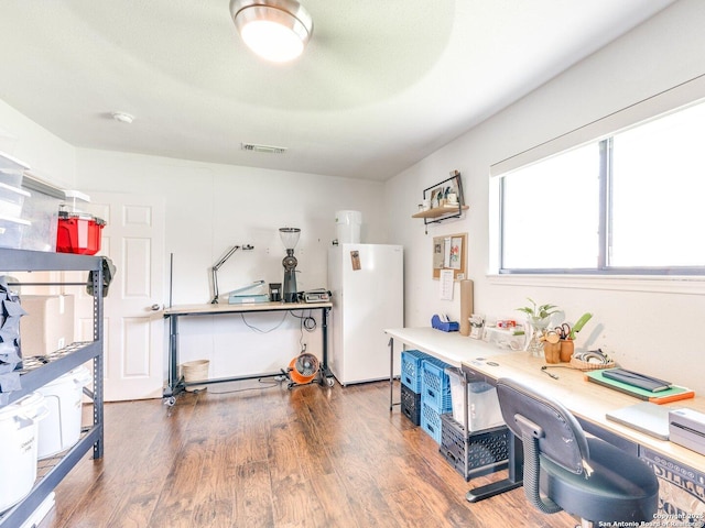 misc room with visible vents and dark wood-style flooring