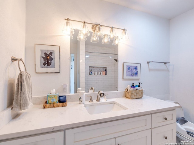 bathroom with a shower and vanity