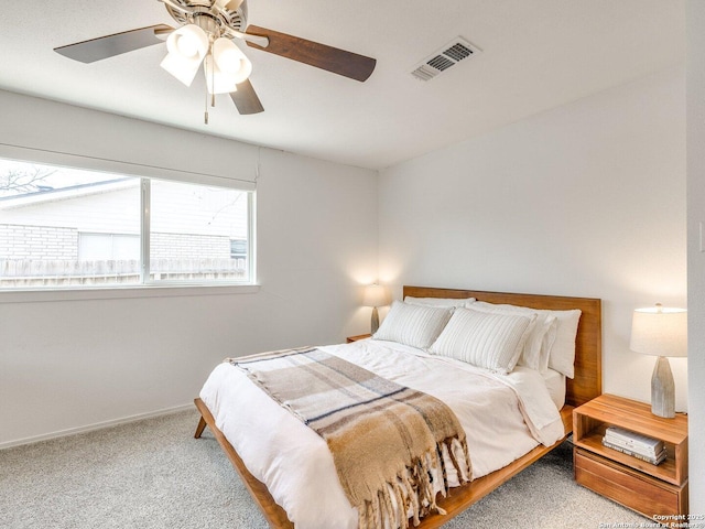 bedroom with ceiling fan, carpet, visible vents, and baseboards