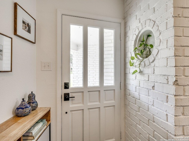 doorway with brick wall