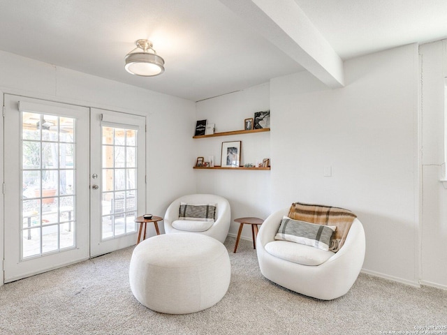 sitting room with carpet, french doors, and baseboards