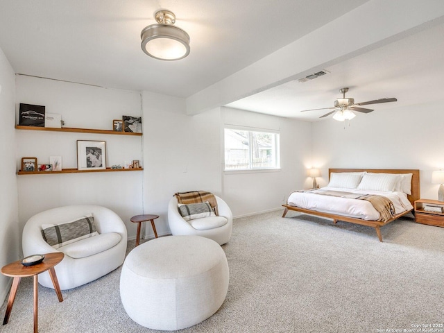 carpeted bedroom featuring a ceiling fan and visible vents