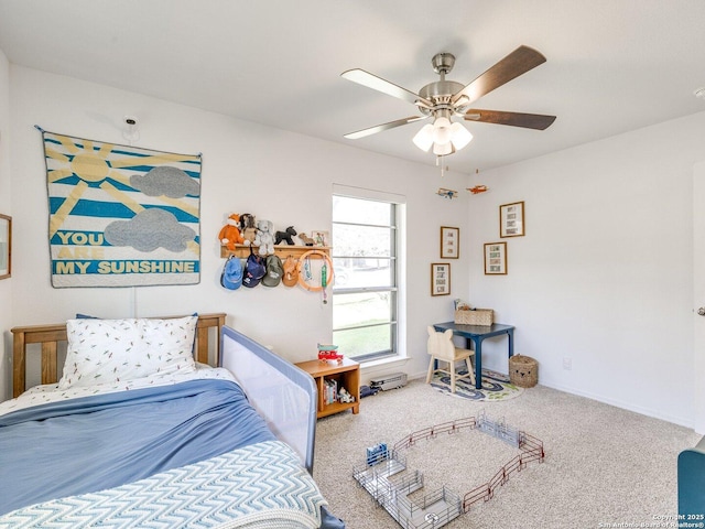 bedroom featuring ceiling fan, carpet, and baseboards