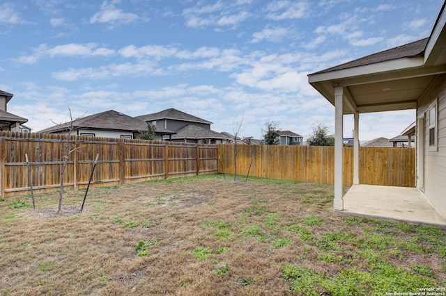 view of yard with a fenced backyard and a patio