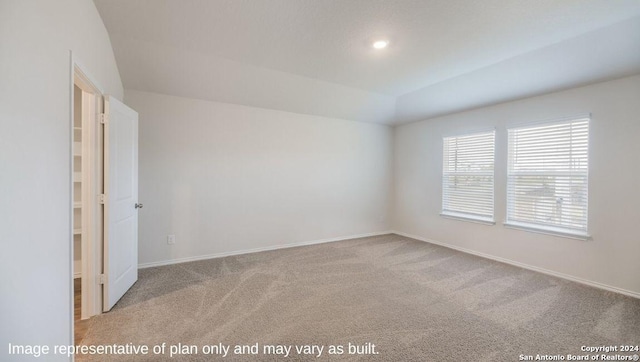 empty room with light carpet, baseboards, vaulted ceiling, and recessed lighting