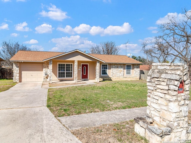 ranch-style home with a garage, stone siding, concrete driveway, and a front yard