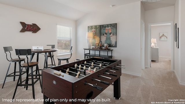 game room with lofted ceiling, light colored carpet, and baseboards