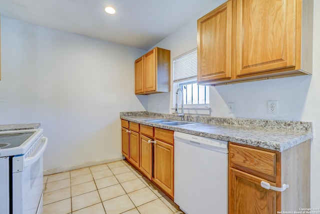 kitchen with white appliances, light tile patterned floors, baseboards, light countertops, and a sink