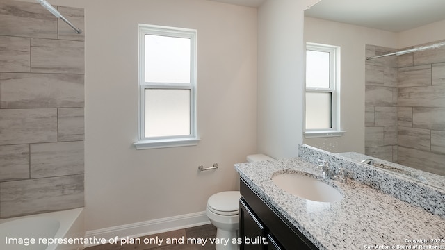 full bathroom with toilet, vanity, and baseboards