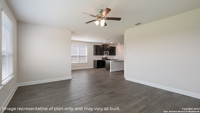 unfurnished living room with visible vents, baseboards, ceiling fan, dark wood-style flooring, and recessed lighting