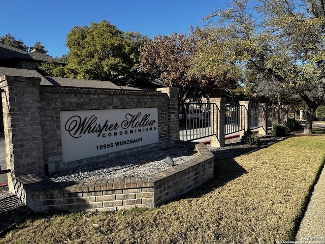 community sign featuring fence