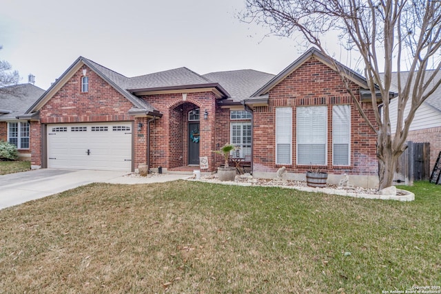 view of front of home featuring a garage, concrete driveway, brick siding, and a front yard