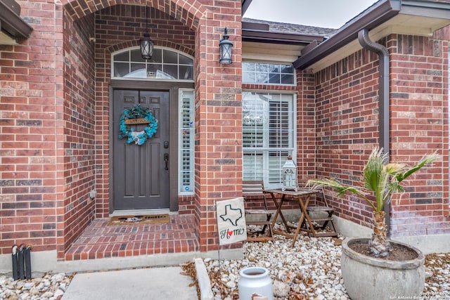 entrance to property with brick siding