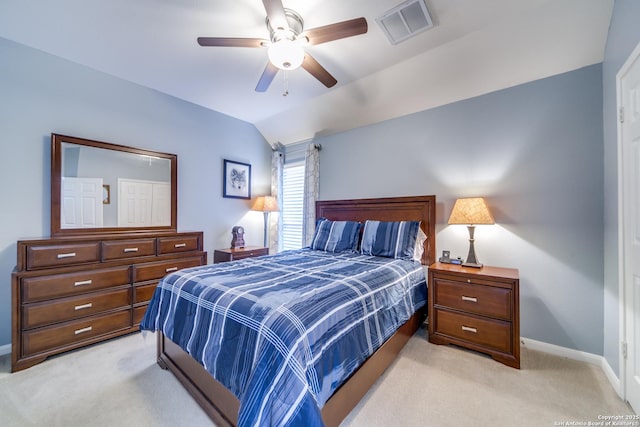 bedroom featuring visible vents, light carpet, vaulted ceiling, ceiling fan, and baseboards