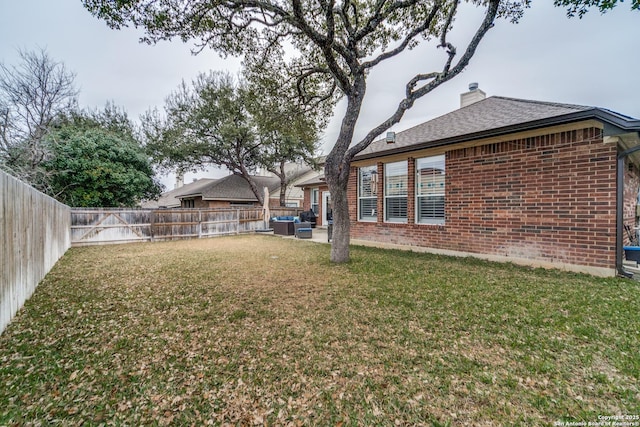 view of yard with a fenced backyard and an outdoor hangout area