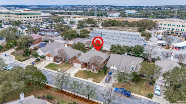 birds eye view of property with a residential view