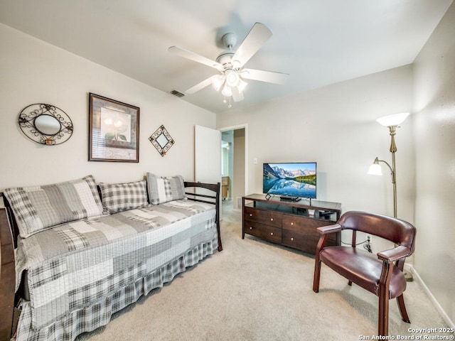 bedroom with a ceiling fan, light colored carpet, and visible vents