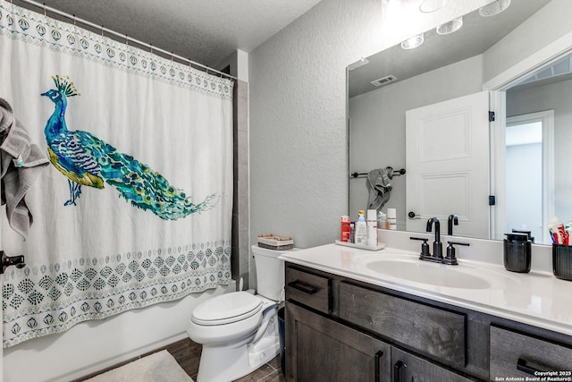 full bath featuring a textured ceiling, a textured wall, toilet, vanity, and shower / bathtub combination with curtain