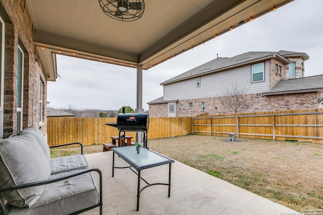 view of patio / terrace featuring grilling area and a fenced backyard