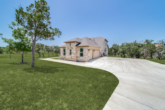 exterior space featuring a yard, driveway, and an attached garage