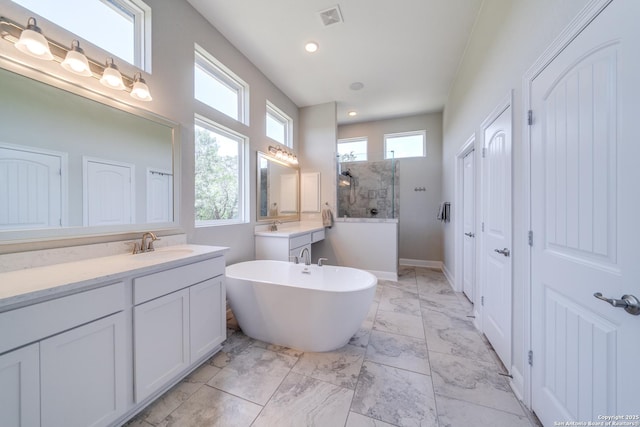 full bathroom with visible vents, a sink, marble finish floor, walk in shower, and two vanities