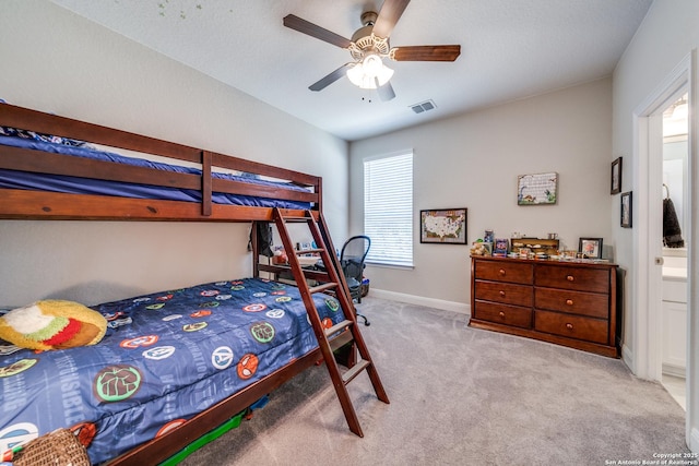 bedroom featuring a ceiling fan, light colored carpet, visible vents, and baseboards