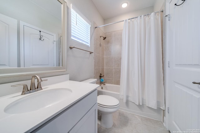 full bath with shower / tub combo, vanity, toilet, and tile patterned floors