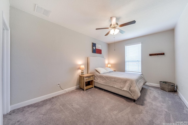 bedroom with light colored carpet, visible vents, ceiling fan, and baseboards