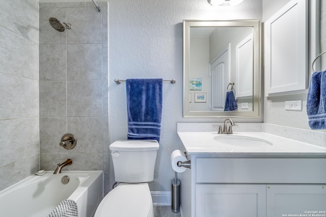 bathroom featuring  shower combination, a textured wall, toilet, and vanity