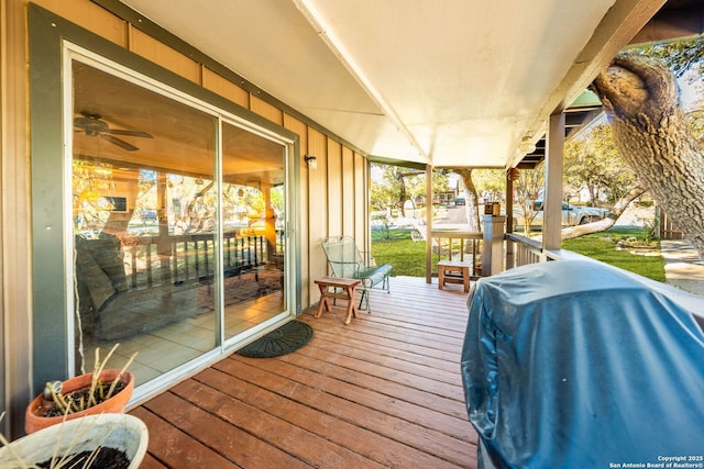 deck featuring covered porch and area for grilling