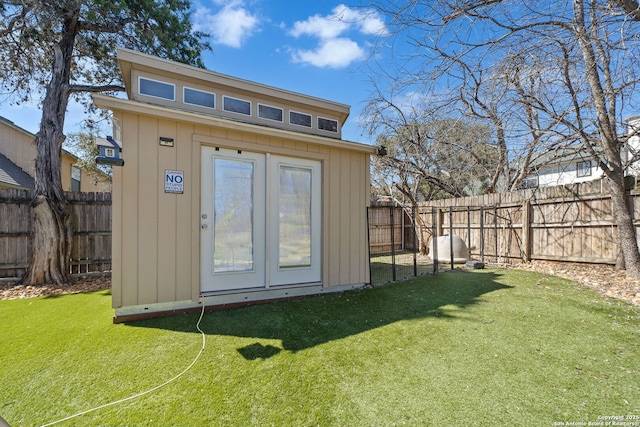 view of shed with a fenced backyard