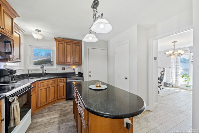 kitchen featuring a center island, decorative light fixtures, dark countertops, electric range, and dishwasher