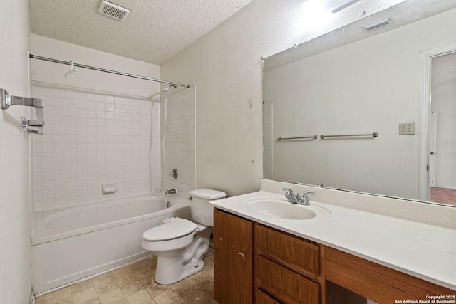 bathroom featuring washtub / shower combination, visible vents, a textured ceiling, and vanity