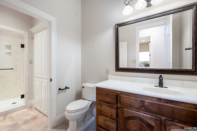 bathroom featuring toilet, a closet, a shower stall, and vanity