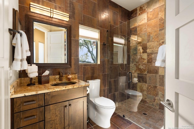 full bath with vanity, a shower stall, toilet, and tile patterned floors