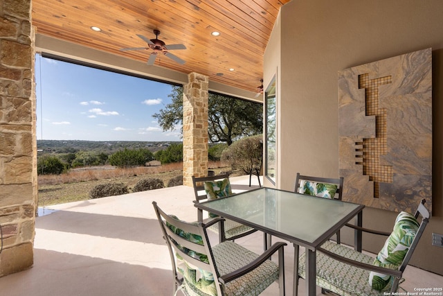 view of patio / terrace with a ceiling fan and outdoor dining space