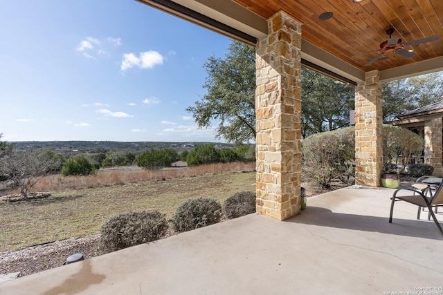 view of patio featuring ceiling fan