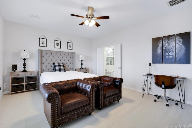 bedroom with ceiling fan, ensuite bath, visible vents, and baseboards