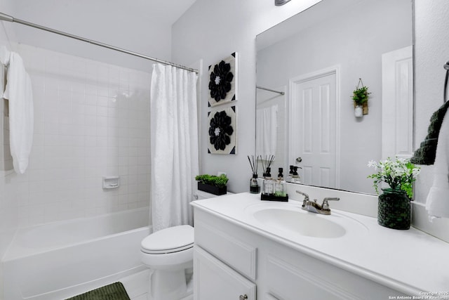 bathroom with shower / tub combo with curtain, vanity, and toilet