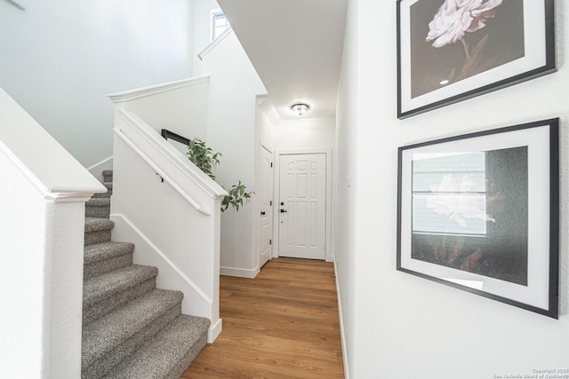 entryway with stairway and wood finished floors