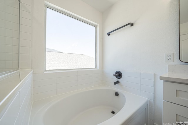 full bath featuring a bath and vanity