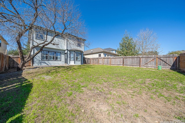 view of yard featuring a fenced backyard