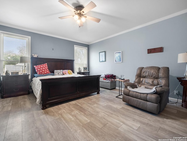 bedroom featuring ornamental molding, multiple windows, and light wood-style floors