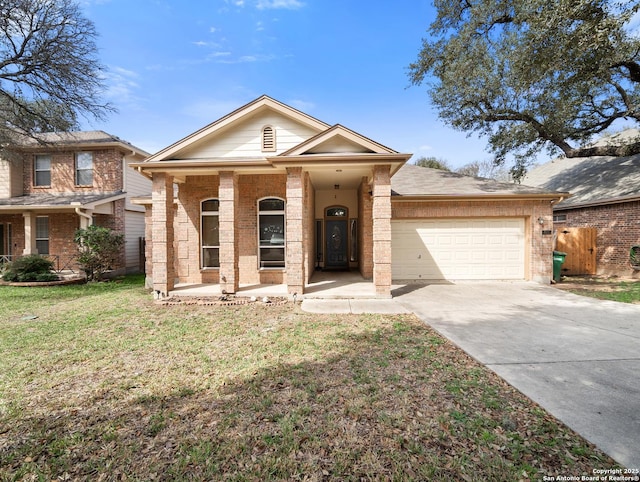 ranch-style house featuring a front yard, brick siding, driveway, and an attached garage