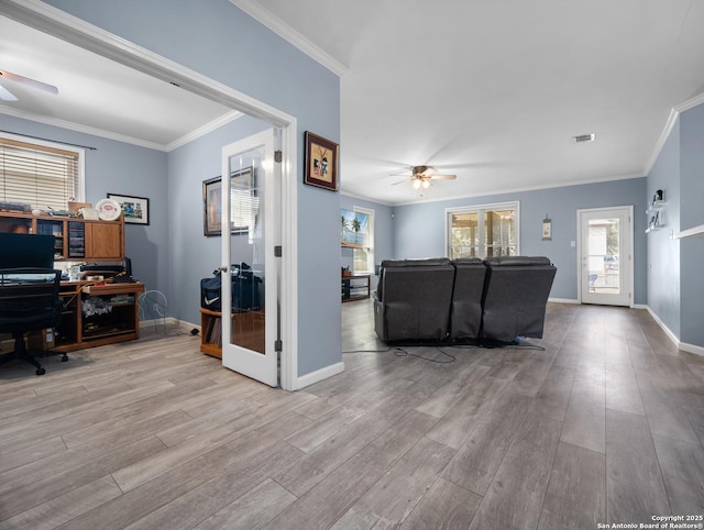 living area featuring french doors, light wood-style flooring, ornamental molding, ceiling fan, and baseboards