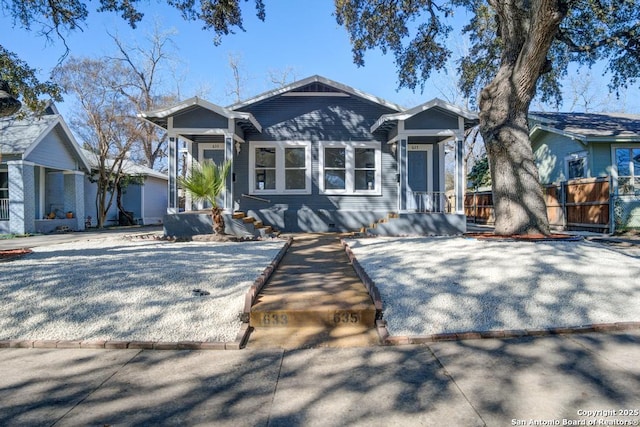 view of front of property featuring fence