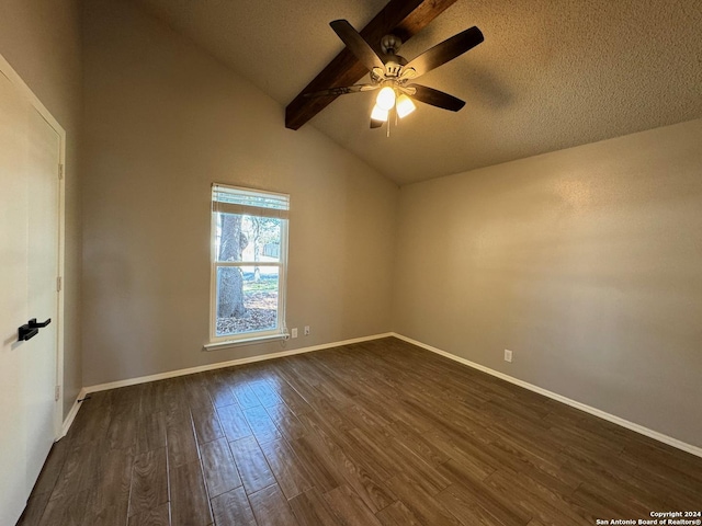 unfurnished room featuring lofted ceiling with beams, a textured ceiling, a ceiling fan, baseboards, and dark wood finished floors