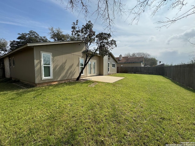 view of yard featuring a patio area and a fenced backyard