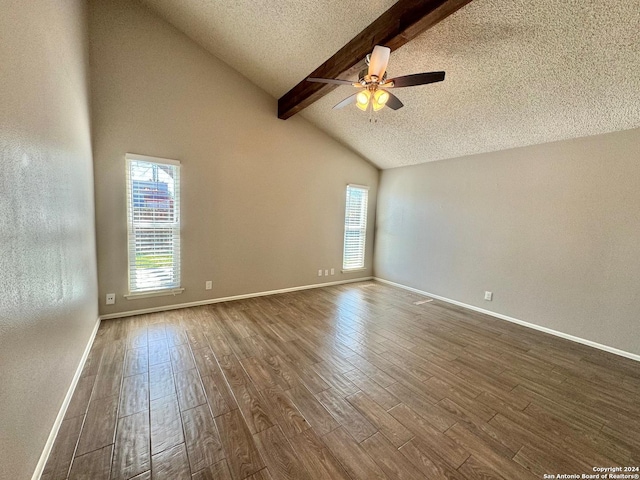 spare room with a ceiling fan, a textured ceiling, wood finished floors, beamed ceiling, and baseboards